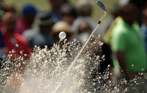 Victor Dubuisson of France hits from a sand trap on the seventh hole during first round play of the Masters golf tournament at the Augusta National Golf Course in Augusta